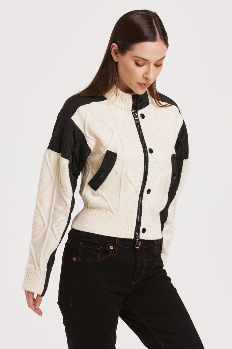 shuri-cable-knit-quilted-jacket-with-button-up-closure-and-ribbed-cuffs-creamblack