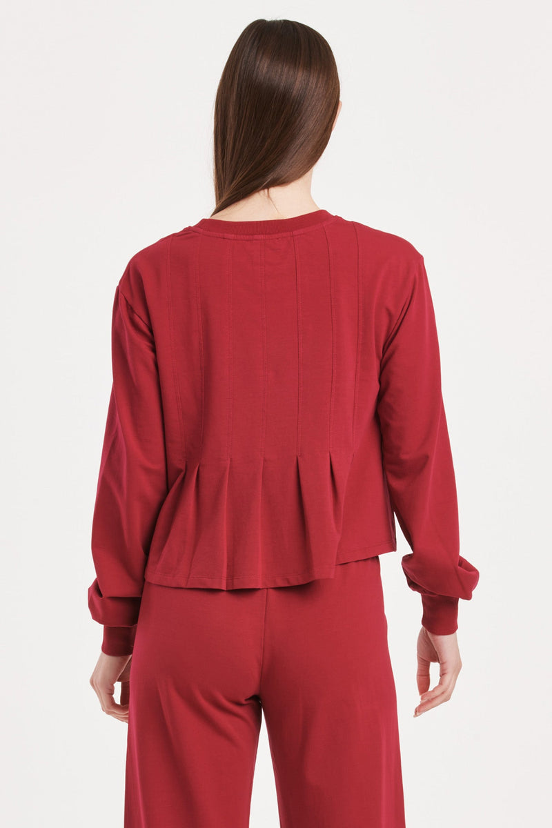 dove-long-sleeve-pleated-peplum-top-granada